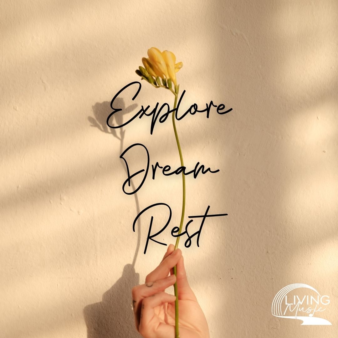 A person holding a flower with a long stem. The accompanying text reads: "Explore. Dream. Rest."